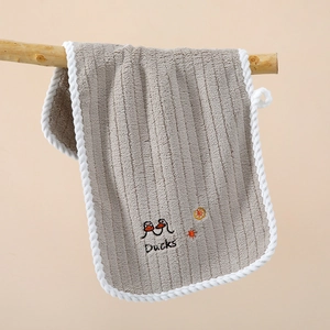 Detail of grey coral fleece towel with duck embroidery and convenient hanging loop