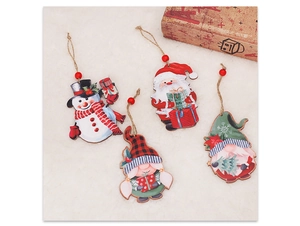 Set of 4 festive wooden Christmas gnomes and Santa Claus pendants on soft fur background