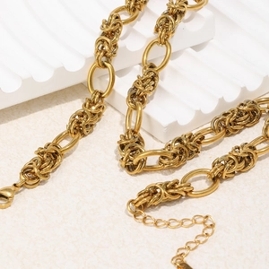 Detail of 18K gold plated stainless steel multi-link chain necklace with oval rings