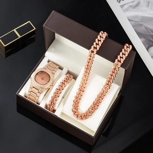 Close-up of hip hop jewelry gift set featuring iced-out watch, Cuban necklace and bracelet