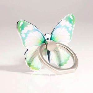 Detail of butterfly phone ring holder featuring blue-green wings and silver metal grip
