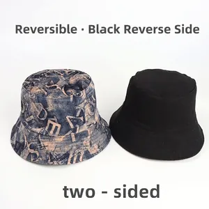 Reversible bucket hat with navy blue letter print and plain black side for sun protection