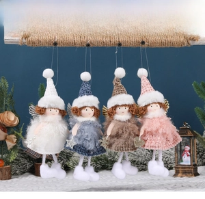 Detail view of colorful angel girl ornaments with knit plaid skirts and feather wings