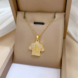 Detailed close-up of a gold-plated number 10 jersey pendant with sparkling rhinestones