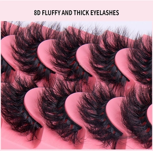 Macro shot of 8D fluffy and thick multilayered eyelashes on a pink tray