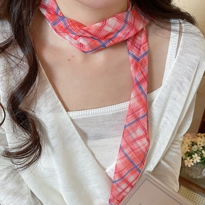 Detailed view of an elegant pastoral plaid mesh scarf necklace with red floral patterns