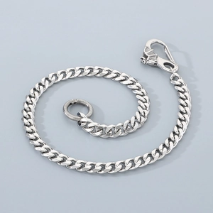 Detail of silver stainless steel cuban link pants chain with dragon head clasp