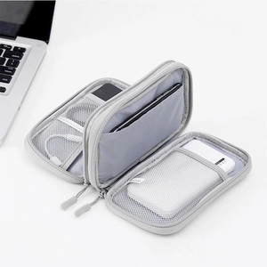 Internal layout of light grey digital accessory pouch with mesh pockets and elastic straps