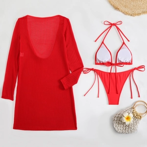 Detailed view of red three-piece bikini set with sheer mesh cover-up and side-tie bottoms
