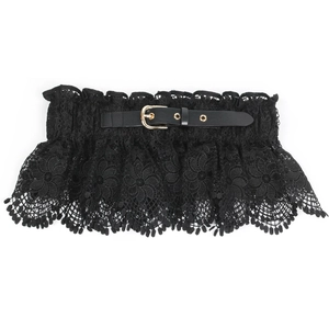 Detailed view of black floral lace corset belt with gold metal buckle on white background