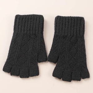 Close-up of black knitted diamond cutout fingerless arm sleeves with detailed texture