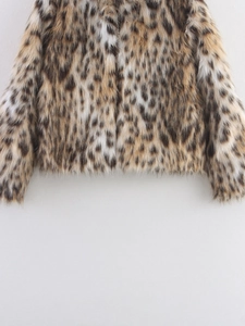 Close-up of leopard print faux fur coat hem showing fluffy texture and premium fur density