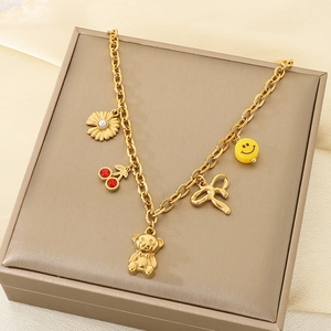 Gold cuban chain necklace with cute bear, smile face, cherry, and floral charms detail