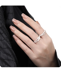 Close-up of S925 sterling silver hollow branch ring with irregular texture on finger