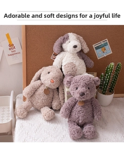 Detailed view of plush bear, bunny, and dog toys with branded neck tags and soft fur texture