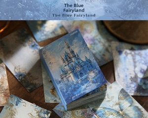 Close-up of vintage blue fantasy theme scrapbooking paper and floral stickers set