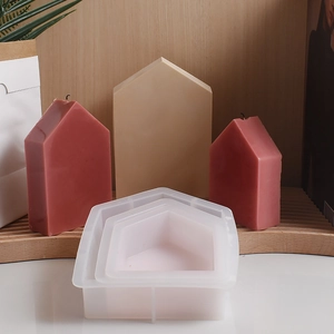 Detailed view of 3-piece house shaped silicone molds with finished resin home decor crafts