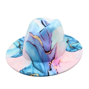 Detailed view of wide brim felt fedora featuring artistic marble print and gold foil trim