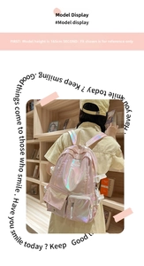 Detail view of pink laser holographic backpack with adjustable straps and metallic finish