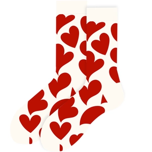 Close-up of white crew socks featuring red heart patterns and soft knitted cotton texture