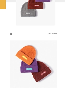 Close-up of ribbed knit beanies in multiple colors with NEWYORK embroidery patches