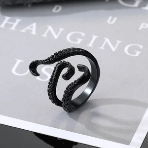 Macro shot of black octopus tentacle ring with detailed suction cups and matte finish