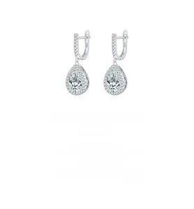 Macro detail of S925 sterling silver pear-shaped drop earrings with sparkling cubic zirconia