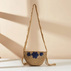 Handmade straw woven crossbody bag with blue floral embroidery and fringe tassels