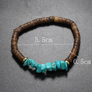 Detail of bohemian coconut shell beaded bracelet with turquoise stones and 5.5cm inner diameter