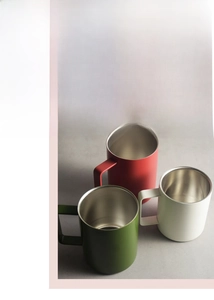 Detail view of double-layer insulated mugs showing matte finish and thermal construction