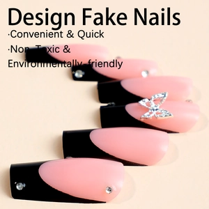 Long coffin false nails with black French tips, silver 3D butterfly, and rhinestones