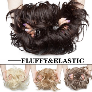 Macro view of fluffy elastic hair buns in various colors for messy updo hairstyles