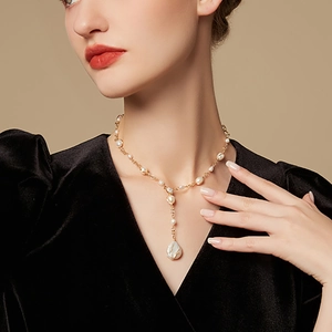 Elegant baroque freshwater pearl necklace with golden chain and drop-shaped pendant
