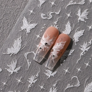 3D embossed white butterfly nail stickers with star patterns on nude gradient nails