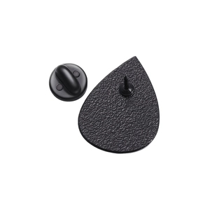 Detail of black teardrop pin back with metal base needle and rubber clutch backing