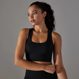 Detail of black seamless knit sports bra featuring breathable honeycomb texture and square neck