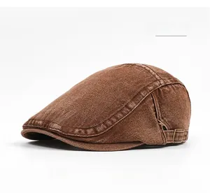 Detail view of coffee-colored cotton beret cap featuring adjustable metal side buckle