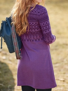 Detail of purple ethnic knit dress featuring intricate geometric leaf patterns on shoulders
