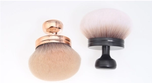 Detailed comparison of two mushroom head powder brushes with soft synthetic bristles