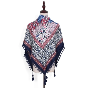 Close-up of Bohemian jacquard scarf featuring ethnic patterns and knotted fringe tassels