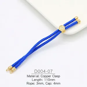 Detailed view of 3mm blue braided cord with 18k gold plated copper slide buckle