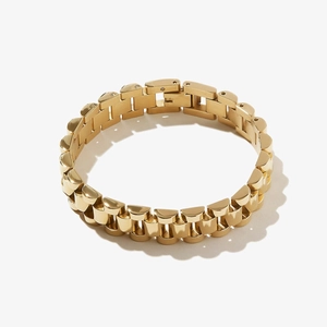 Polished 18k gold plated stainless steel watch-link chain bracelet on a neutral background