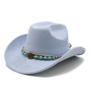 Detail of light blue faux suede cowboy hat featuring turquoise beads and sunburst metal badge