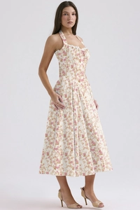 Detail of summer slim floral maxi dress with halter neck and floral pattern print