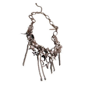 Silver layered necklace with sparkling star pendants and tassel chains on white background