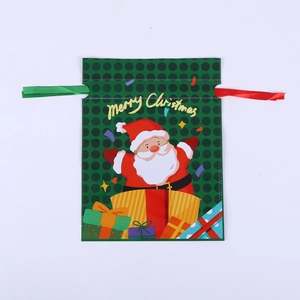 Detail of Christmas drawstring gift bag with Santa Claus motif and Merry Christmas text