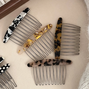 Elegant 10-tooth acetate hair combs in marble, amber and leopard patterns for women