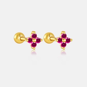 Detailed macro view of S925 sterling silver four-leaf clover studs with pink gemstones