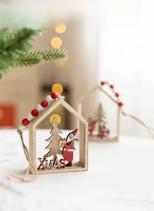 Detail of Nordic wooden Christmas house ornament with Santa Claus and XMAS text
