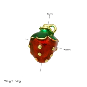 Detail of red strawberry enamel pendant with dimensions 18mm by 11mm and 5.8g weight